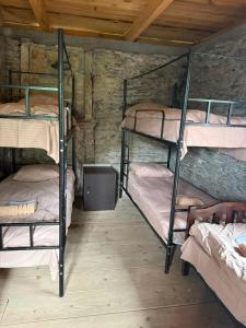 a room with four bunk beds in a cabin at Guesthouse Mountain House in Khalde