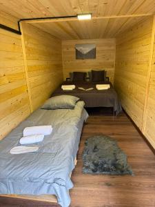 a room with a bed in a wooden cabin at Guesthouse Mountain House in Khalde +6 photos