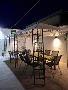a group of tables and chairs under a tent at Blue and white in Pleven +15 photos