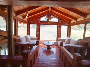a living room with couches and a table at Taytapak Wasi in Riobamba