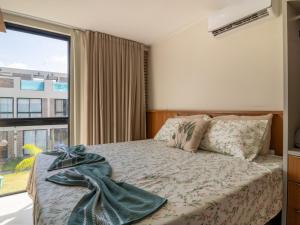a bedroom with a bed and a large window at Villa 18 Atins Rooftop com piscina in Barreirinhas +18 photos
