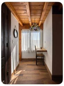 a dining room with a table and a window at Casa Nautilis in San Miguel