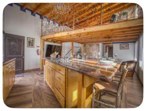 a large kitchen with a large wooden counter top at Casa Nautilis in San Miguel +1 photo
