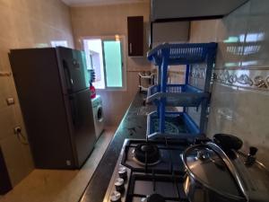 a kitchen with a stove and a stove top oven at La Luna Rentals in Asilah
