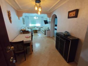 a living room with a table and a couch at La Luna Rentals in Asilah +69 photos