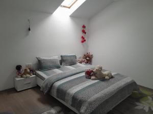 a bedroom with two beds with teddy bears on them at Casa Maria in Curtea de Argeş +20 photos
