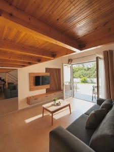 a living room with a couch and a table at RiverMount Hotel Borsh in Borsh