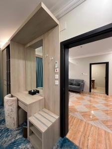 a living room with a couch and a table at The High View Hotel - ذا هاي فيو in Al Baha