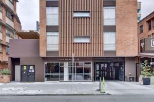 a facade of a building with a storefront at Parque de La 93 - Elite Flats in Bogotá