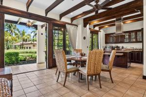a kitchen and dining room with a table and chairs at Resort Villa Pool Golf & Beach Access in Playa Avellana
