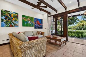 a living room with a couch and a table at Resort Villa Pool Golf & Beach Access in Playa Avellana +52 photos