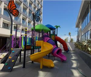 a playground with a slide and a slide at GAV Beach Resort - Smart in Salinópolis +1 photo