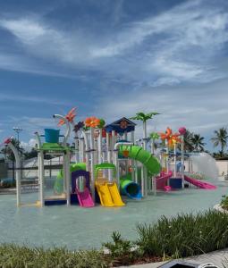a playground with different colored slides and slidesktop at GAV Beach Resort - Smart in Salinópolis