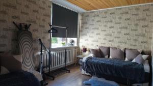 a living room with a bed and a window at Hannah in Krāslava