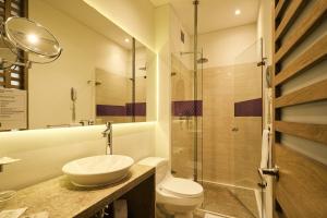 a bathroom with a sink and a toilet at Mercure Bogota BH Retiro in Bogotá +17 photos