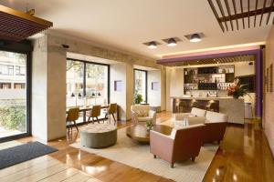 a living room with couches and a table at Mercure Bogota BH Retiro in Bogotá