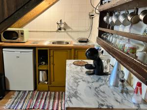 a kitchen with a counter top and a sink at Casa Medieval de Nisa in Nisa +16 photos