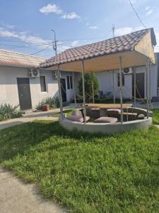 a house with a covered patio in the yard at Zvartnoc siti star in Pʼarakʼar