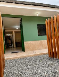 a doorway to a room with a green wall at Misky wasy laguna azul in Sauce