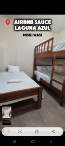 a picture of two bunk beds in a room at Misky wasy laguna azul in Sauce
