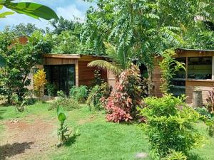 a house with a garden in front of it at Mystic Moment in Negril