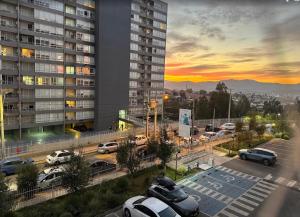 a parking lot with cars parked in a parking lot at Acogedor apartamento in Quilpué