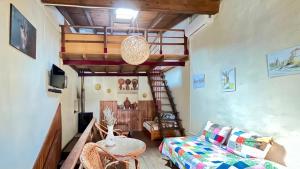 a living room with a loft bed and a couch at Casa Medieval de Nisa in Nisa