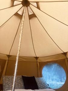 a close up of a tent with a window at Sora Bell Tent in Coxwold