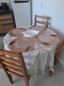 a wooden table with a bowl on top of it at Brisa do mar região dos lagos in São Pedro da Aldeia +11 photos