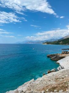 a view of the ocean from a rocky shore at Lukova rooms in Lukovë