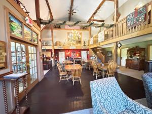 a dining room with a table and chairs at The Barn Inn Bed and Breakfast in Millersburg