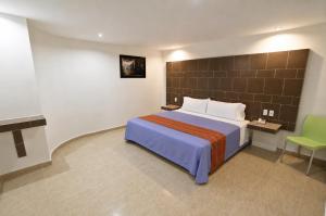 First Inn Hotel & Business में एक कमरे में एक या कई बेड
