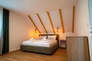 a bedroom with a bed in a room at Holiday Home Ari in Lički Ribnik