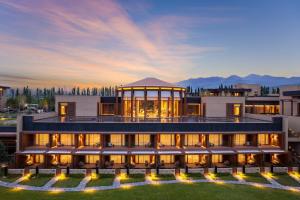 a rendering of a building with mountains in the background at Hotel Indigo Nalati by IHG in Narat