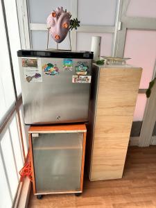 a refrigerator with a pig head on top of it at Beautiful Loft 10 minutes from AIFA in San Pedro Atzompa