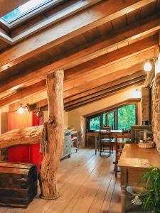 a living room with wooden floors and wooden ceilings at Ca' Bella Hospitality in Vignole Borbera