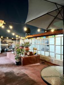 a patio with a table and some potted plants at Beautiful Loft 10 minutes from AIFA in San Pedro Atzompa