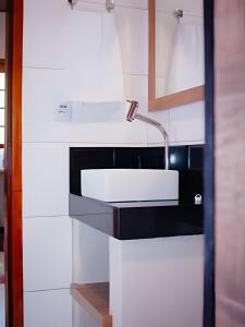 a kitchen with a sink and a faucet at Vila dos Poetas in Barreirinhas +88 photos