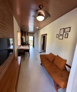 a living room with a couch and a table at Vila dos Poetas in Barreirinhas