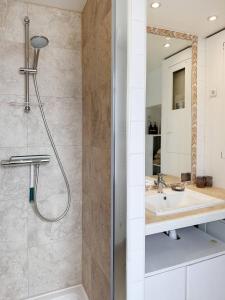 a bathroom with a shower and a sink at C34-Panorama in Chantilly +19 photos