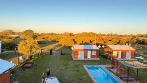 an aerial view of a backyard with a house and a pool at Posada La Martina in Goya