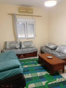 a living room with a couch and a coffee table at Dar mouni relax in Oran