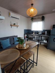 a living room with a table and a couch at Alma Libre 01 in Fortuna