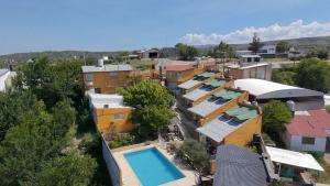 an aerial view of a town with a pool at Complejo El Alto in Tanti