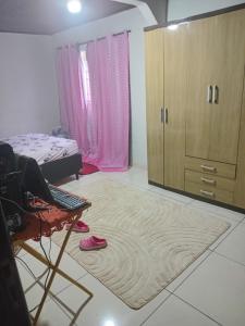 a bedroom with a bed and a large rug at Leandra in Ponta Porã