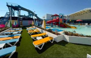 a pool with a bunch of chairs and a water park at 211 Holiday Resort Unity 6 berth Passes Optional No Pets in Brean