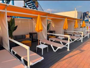 a deck with chairs and umbrellas on a cruise ship at 211 Holiday Resort Unity 6 berth Passes Optional No Pets in Brean