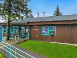 a building with a sign that reads sound system lodge at Seward Adventure Lodge in Seward