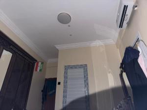 a ceiling with a door in a room at Amran Tower in Mogadishu