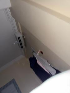 a small room with a bed in the corner at Amran Tower in Mogadishu